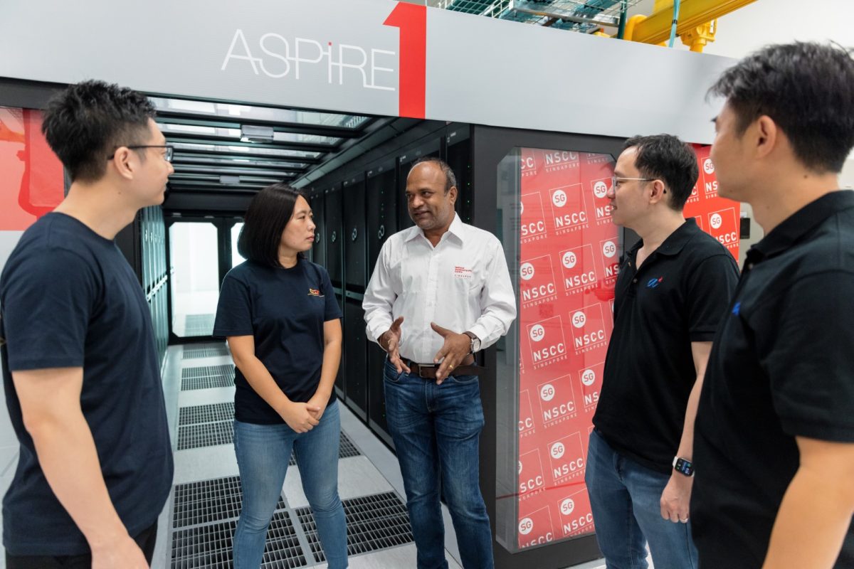 People meeting in front of the ASPIRE 1 supercomputer at NSCC