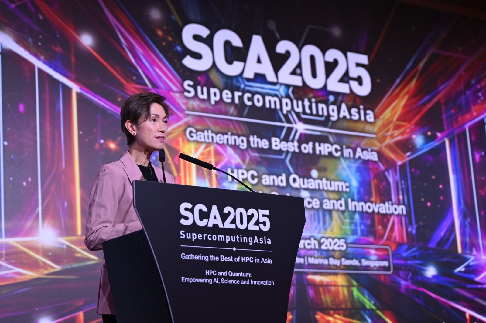 Singapore's Minister for Digital Development and Information Mrs Josephine Teo at the SCA2025 podium.